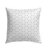 Geometric pattern monochrome maze pillow in garden setting.
